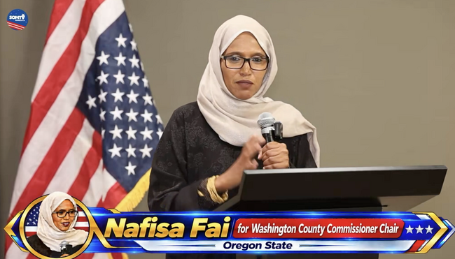 Somali Democrat Commissioner Who Held Rally in Somali with Upside Down Flag Caught Disrespecting the Old Glory During the Pledge of Allegiance